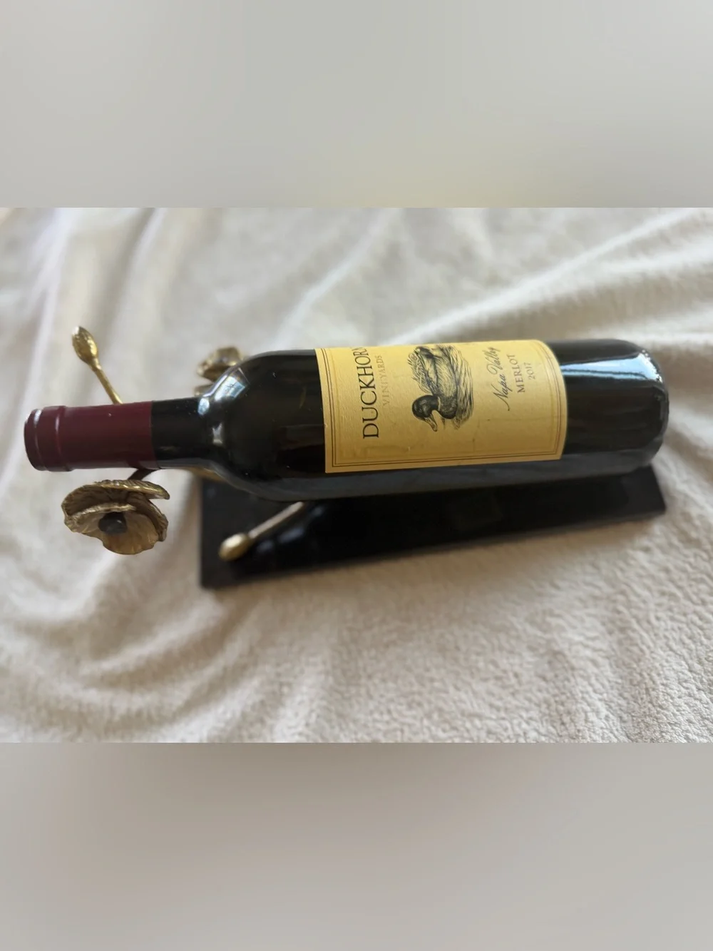 Michael Aram Gold Floral Wine Bottle Holder with Black Base and Burgundy Neck